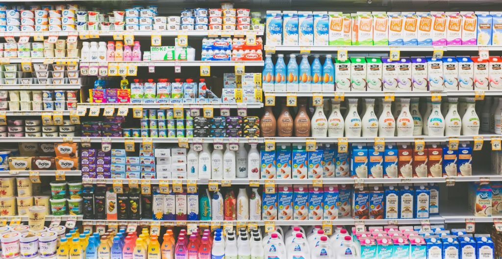 a plethora of dairy products on a supermarket shelves